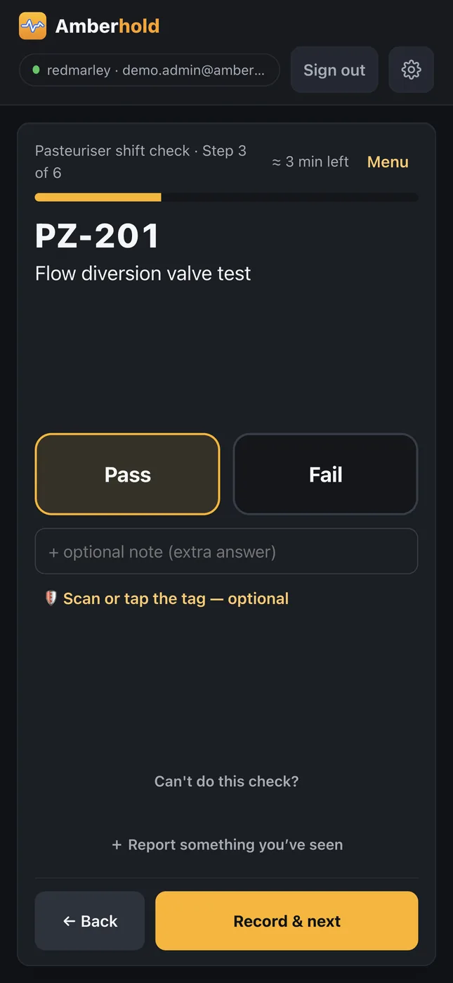 A round in the Amberhold app: a pass or fail check at one point, with the scan-or-tap step